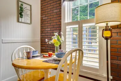 a dining room with a table and chairs and a window at Quaint Mt Vernon Cottage Near Historic Dtwn! in Mount Vernon