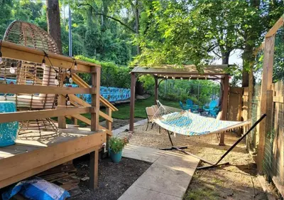 a patio with a hammock and a swing set at Tremont! 7 min to downtown Cleveland in Cleveland