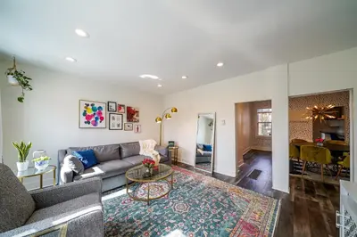a living room with a couch and a table at Tremont! 7 min to downtown Cleveland in Cleveland