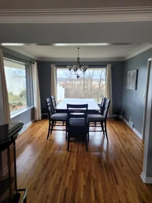 a dining room with a table and chairs at dock, game room, bar and private river view patio in Toledo
