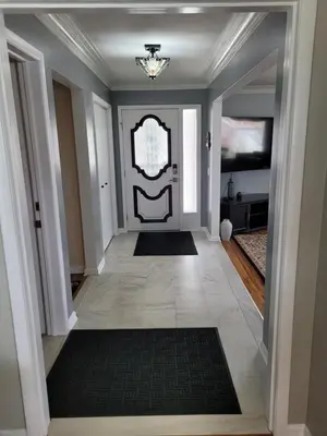 a hallway with a door with a mirror and a rug at dock, game room, bar and private river view patio in Toledo