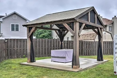 a wooden gazebo with a table in a yard at Welcoming Ohio Getaway Less Than 9 Mi to Dtwn Toldeo! in Toledo