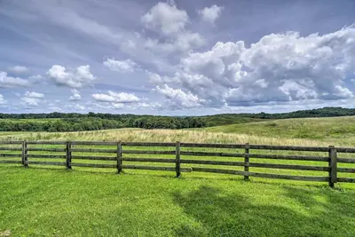 a wooden fence in the middle of a field at McArthur Cabin Peaceful Getaway on Farm! in McArthur