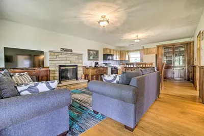 a living room with two couches and a fireplace at McArthur Cabin Peaceful Getaway on Farm! in McArthur