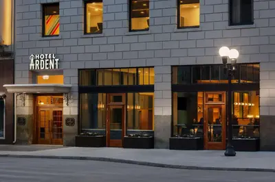a facade of a building with glass doors and a street light at Hotel Ardent Dayton Downtown, Tapestry Collection By Hilton in Dayton