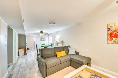 a living room with a couch and a table at Welcoming Kentucky Home with Sprawling Views! in Corinth