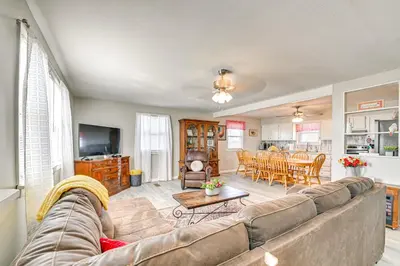 a living room with a couch and a table at Welcoming Kentucky Home with Sprawling Views! in Corinth