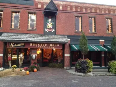 a large brick building with a store in a street at Historic Comfy German Village Haus sleeps6petsOK in Columbus