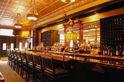 a bar with a bunch of bottles of wine at Historic Comfy German Village Haus sleeps6petsOK in Columbus
