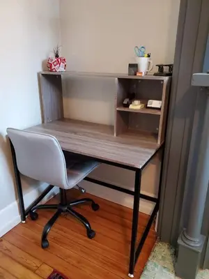 a desk with a white chair and a wooden table at Walkable And Cozy German Village Hauspets Ok in Columbus