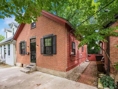 a red brick house with black windows at Cute German Village LilHausCity ParkPetsOK in Columbus