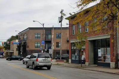 a car driving down a street in a small town at Super Close to Hot Spots in Ohio City, Cleveland in Cleveland