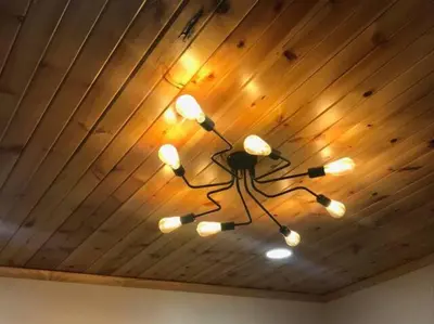a chandelier hanging from a wooden ceiling at Super Close to Hot Spots in Ohio City, Cleveland in Cleveland