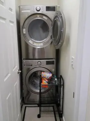 a washer and dryer in a small room at Super Close to Hot Spots in Ohio City, Cleveland in Cleveland