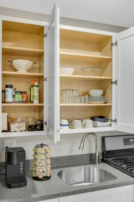 a kitchen with a sink and a counter top at Sycamore Suite - Main Street Lodge in Berlin in Berlin