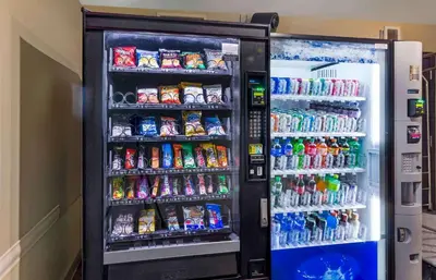 a refrigerator filled with lots of drinks and soda at Extended Stay America Select Suites - Cleveland - Airport in Cleveland