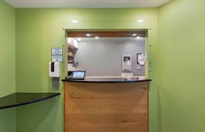 a counter in a room with a mirror at Extended Stay America Select Suites - Cleveland - Airport in Cleveland