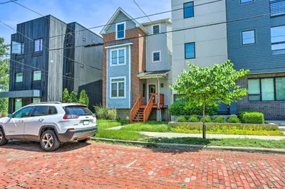 a car parked in front of a house at about 2 Mi to Downtown - Cozy Cleveland Unit in Cleveland