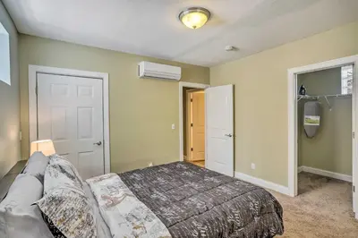 a bedroom with a bed and a couch in it at about 2 Mi to Downtown - Cozy Cleveland Unit in Cleveland