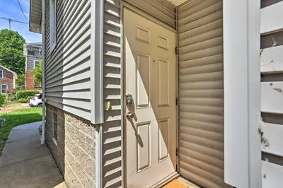 a door to a garage with a house at about 2 Mi to Downtown - Cozy Cleveland Unit in Cleveland