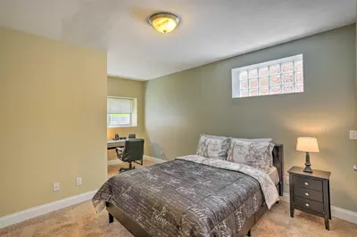 a bedroom with a bed and a desk in it at about 2 Mi to Downtown - Cozy Cleveland Unit in Cleveland