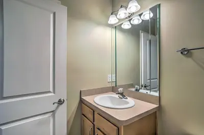 a bathroom with a sink and a mirror at about 2 Mi to Downtown - Cozy Cleveland Unit in Cleveland