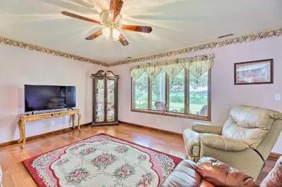 a living room with a ceiling fan and a couch at Charming Williamstown Retreat with Private Yard in Williamstown