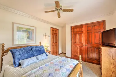 a bedroom with a bed and a ceiling fan at Charming Williamstown Retreat with Private Yard in Williamstown
