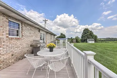 a patio with a table and chairs on a balcony at Charming Williamstown Retreat with Private Yard in Williamstown