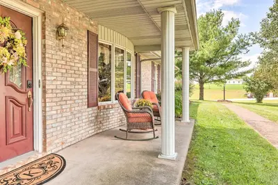 a porch of a house with chairs on it at Charming Williamstown Retreat with Private Yard in Williamstown