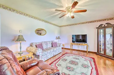 a living room with a couch and a ceiling fan at Charming Williamstown Retreat with Private Yard in Williamstown