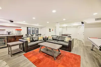 a living room with couches and a pool table at Family-Friendly Brookville Home with Hot Tub! in Brookville