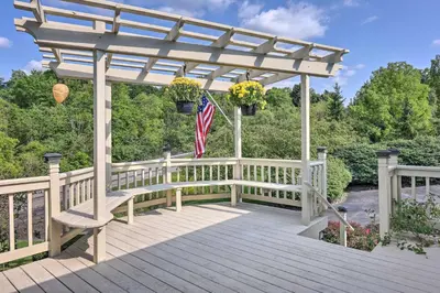 a gazebo with a flag and flowers on it at Family-Friendly Brookville Home with Hot Tub! in Brookville