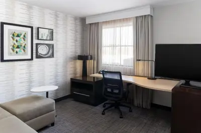 a hotel room with a desk and a television at Residence Inn by Marriott Youngstown Warren/Niles in Niles