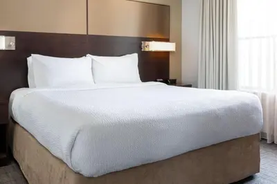 a large bed in a hotel room at Residence Inn by Marriott Youngstown Warren/Niles in Niles