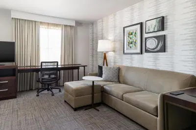 a living room with a couch and a desk at Residence Inn by Marriott Youngstown Warren/Niles in Niles