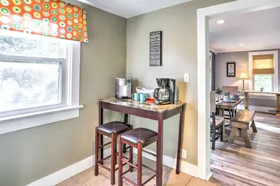 a kitchen with a counter and stools in a room at Sweetwater Hideaway - Blocks to Lake Erie! in Port Clinton