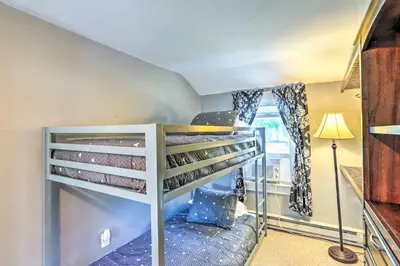 a bunk bed in a room with a window at Sweetwater Hideaway - Blocks to Lake Erie! in Port Clinton