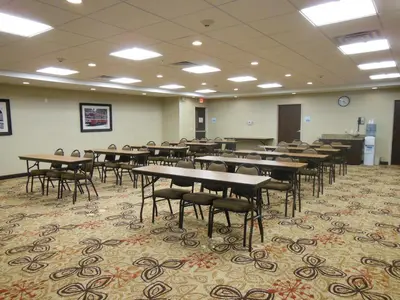 a classroom with tables and chairs in a room at Holiday Inn Express & Suites Washington - Meadow Lands by IHG in Washington