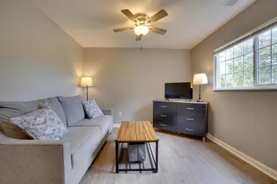 a living room with a couch and a table at Dtwn Columbus Getaway Pet Friendly with Fee! in Columbus