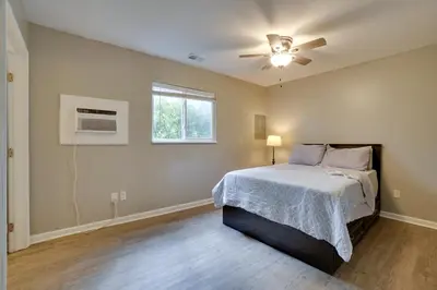 a bedroom with a bed and a ceiling fan at Dtwn Columbus Getaway Pet Friendly with Fee! in Columbus