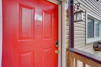 a red door on the side of a house at Dtwn Columbus Getaway Pet Friendly with Fee! in Columbus