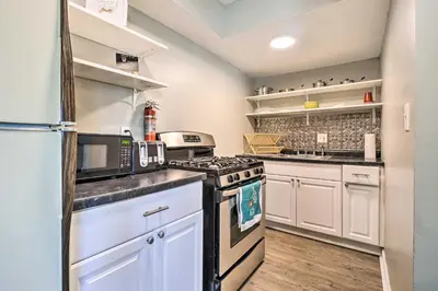 a kitchen with white cabinets and a stove at Dtwn Columbus Getaway Pet Friendly with Fee! in Columbus