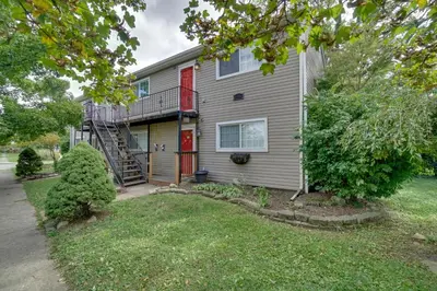 a house with a staircase on the side of it at Dtwn Columbus Getaway Pet Friendly with Fee! in Columbus