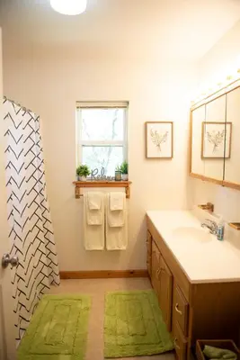 a bathroom with a sink and a mirror at Biker Hiker friendly 3 bedroom by Strouds Run State Park in Athens