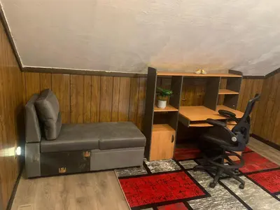 a room with a couch and a desk and a chair at Cherry712upstairs in Fairborn