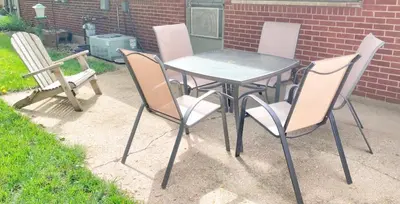 a table and four chairs sitting around a table and a table and chairs at Cheerful 3-BR home near Downtown Dayton, Wright Patterson AFB and Airport in Dayton