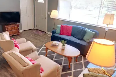 a living room with couches and a tv at Cheerful 3-BR home near Downtown Dayton, Wright Patterson AFB and Airport in Dayton