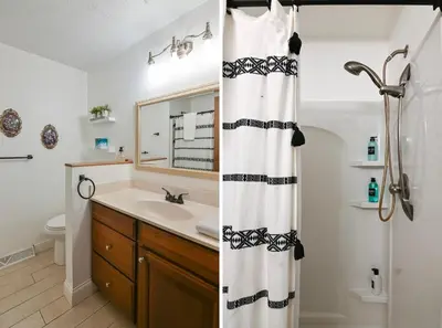 a bathroom with a shower curtain and a sink at Sleeps 12, Wooded Lot, Near Ark, Great for Family in Williamstown