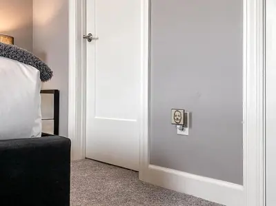 a door in a room with a bed and a pillow at Soaring 2-Bedroom Parkside Loft Walkable to it All in Cincinnati